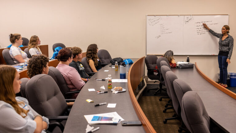 A speaker giving a presentation to a group of students at our 2022 YES Leadership Conference